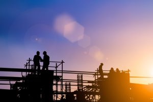 Silhouette,Of,Engineer,And,Construction,Team,Working,At,Site,Over